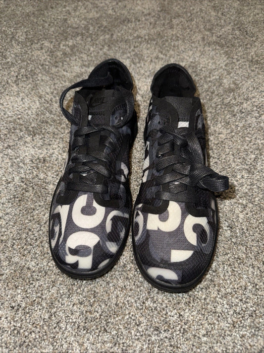 Size 7 Women’s - Comme des Garçons x Nike Dunk Low Monogram Print